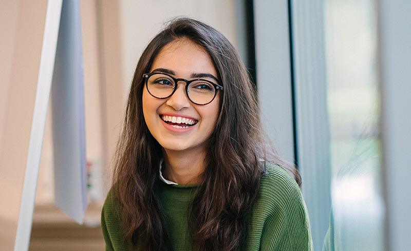 Girl smiling and looking away